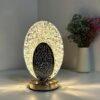 6ed2b716-4f39-4dc2-8e75-d7cf346dbf39.jpg Oval Crystal LED Table Lamp - مصباح طاولة LED كريستالي بيضاوي الشكل